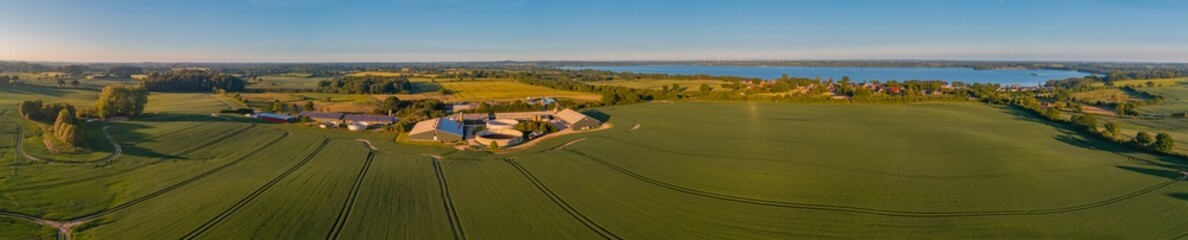 Panorama aerial view of countryside with biogas plant with tanks with liquid manure. Aerial view of...