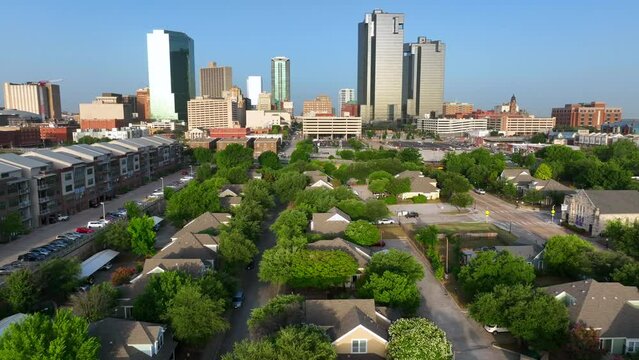 Residential neighborhood in Fort Worth Texas. Urban city skyline in distance. Golden hour shot.