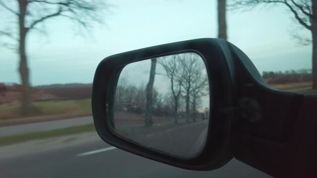 shot of a rear view mirror driving around in the Netherlands