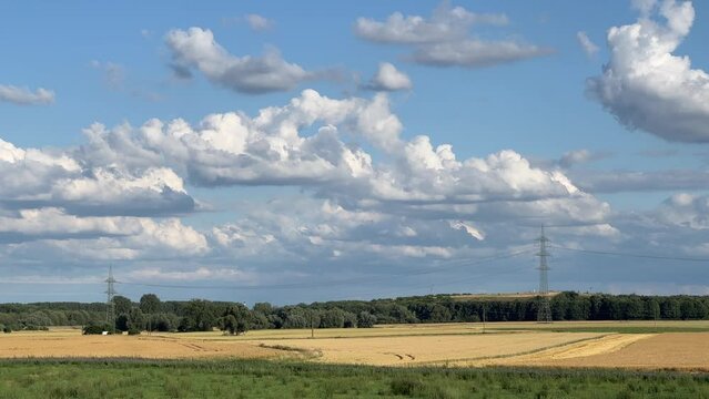 Summer landscape in Germany with electric pylons