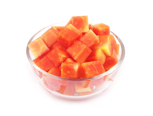 Red papaya fruit slices in glass bowl isolated on white background	