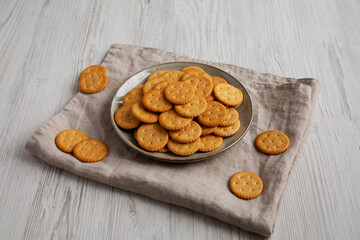 Salty Round Crackers on a Plate, side view.