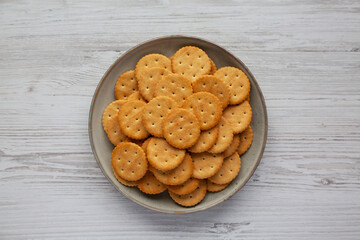 Salty Round Crackers on a Plate, top view. Flat lay, overhead, from above.