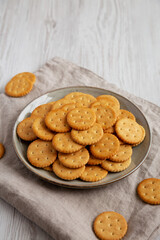 Salty Round Crackers on a Plate, side view.