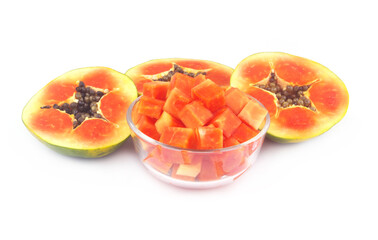 Sliced red papaya fruit in glass bowl and isolated on white background.	