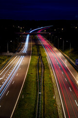 Fototapeta na wymiar most nad autostradą Mszana, polska, Autostrada A1, światła miasta, light trail, night, Road, street light, city street, speed, 