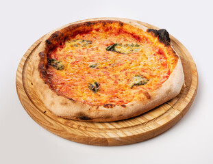 Top view of hot pizza on a wooden stand.