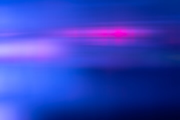 Defocused light overlay. Blur neon glow. Sci-Fi LED glare. Blur navy blue magenta pink color flare flecks motion futuristic abstract copy space background.