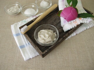 Homemade toothpaste from three ingredients with coconut oil, xylitol and chalk powder