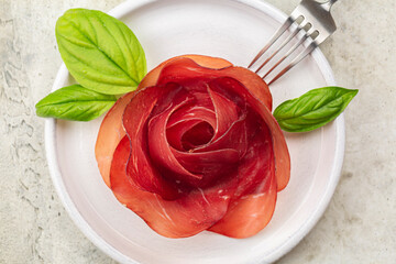Meat Rose For A Charcuterie Board made from Slices of Bresaola, air dried salted beef cold cut.