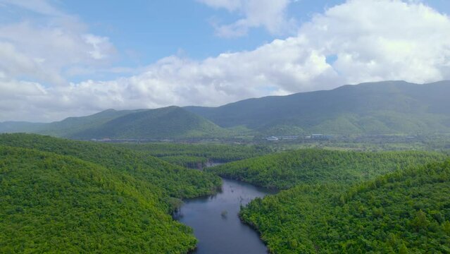 Aerial landscape with green hills, river and forest