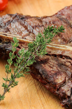 a large steak of tibon meat on a board, macro photo
