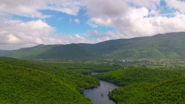 Aerial time lapse landscape with green hills, river and forest, timelapse or hyperlapse concept