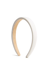 Subject shot of a wide white headband covered with silky fabric. The hairband is isolated on the white background. Vogue accessory for ladies and girls.