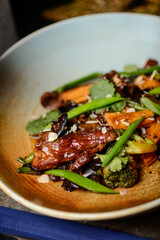 warm salad with meat in teriyaki sauce
