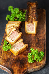 meat pate croute dough pork or beef, chicken french food fresh meal food snack on the table copy space food background rustic 