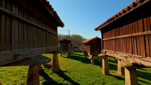 Group of many typical Galician Granaries in Ourense, A merca, dolly in, day