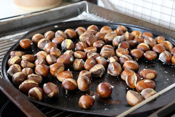 roasted chestnuts on a baking tray
