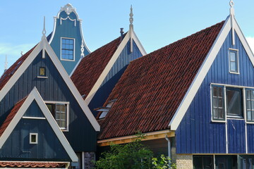 Colorful and historic house facades in De Rijp, Alkmaar, North Holland, Netherlands. De Rijp is known for its rijksmonuments, which include some of the oldest wooden houses of North Holland