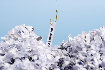 Word Password hooked on fishing hook pulled from pile of shredded documents on blue background