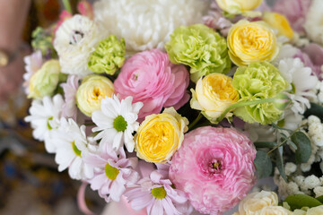 Delicate bouquet of pastel shades of peonies and chrysanthemums