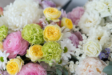 Delicate bouquet of pastel shades of peonies and chrysanthemums