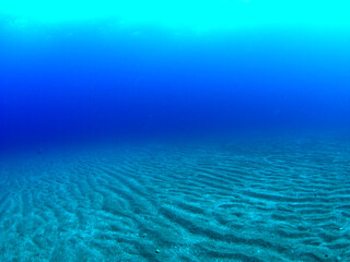 Fototapeta na wymiar One side of the seabed and the blue sea