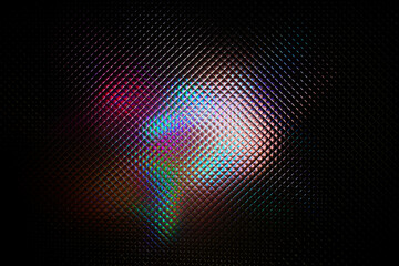Multicolored abstract colorful pattern. Light glares with a spectral gradient on a dark background.