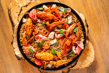 Gourmet seafood paella with pink marine prawns and mussels