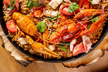 Gourmet seafood paella with pink marine prawns and mussels