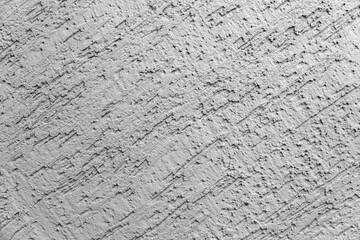 The background of the gray wall, plastered surface. Top view. Backgrount or texture for design