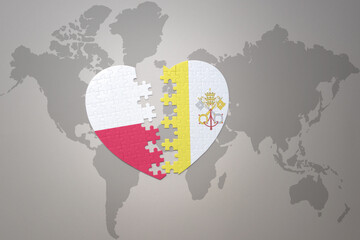 puzzle heart with the national flag of vatican city and poland on a world map background.Concept.