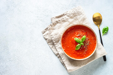 Tomato soup. Traditional vegetable soup. Top view on white background.