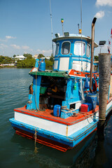 A fishing boat moored at a jetty