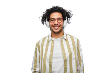 music, technology and people concept - happy smiling young man in headphones over white background