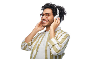 music, technology and people concept - happy smiling young man in headphones over white background