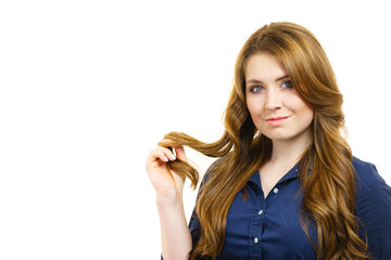 Woman with long hair shows healthy ends