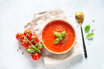 Tomato soup. Traditional vegetable soup. Top view on white background.