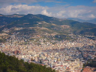 Obraz premium Alanya, turkey, winter walk by mediterranean sea. Ariel view of Alanya harbor from Alanya peninsula. Turkish Riviera by winter day. Beautiful cityscape. Turkish resort.