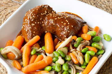 Roe deer tenderloin in sauce cooked at low temperature with sauteed vegetables and mushrooms