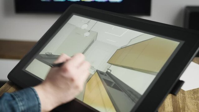 A professional architect draws a room sketch on a digital tablet. Creation of new spaces and interiors