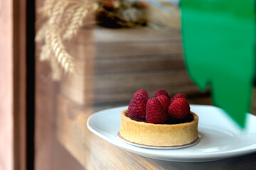 raspberry cake seen through glass