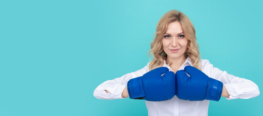 Obraz premium Girl power. successful woman in boxing gloves has business success, boss. Woman isolated face portrait, banner with mock up copy space.