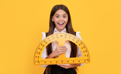 amazed teen girl in school uniform hold mathematics protractor for measuring, education