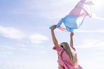 Young woman with trans flag