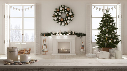 Wooden vintage table top or shelf with candles and pebbles, zen mood, over Christmas living room with tree and fireplace, panoramic windows on winter landscape, interior design