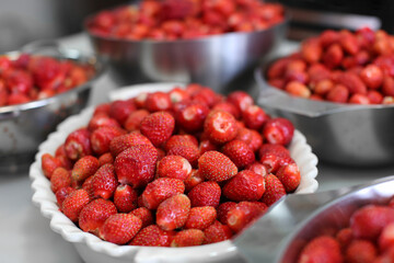 ripe fresh strawberries in bowls