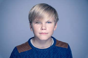 Portrait of  attractive blond teen boy 12-14 year old