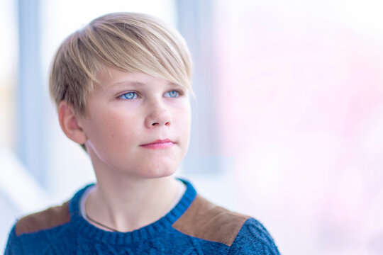 Portrait of  attractive blond teen boy 12-14 year old