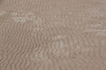 wind blown sand waves on beach